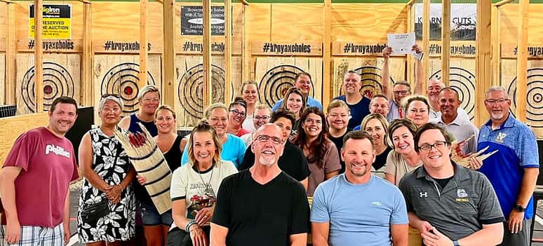 Guests posing in the axe throwing lanes
